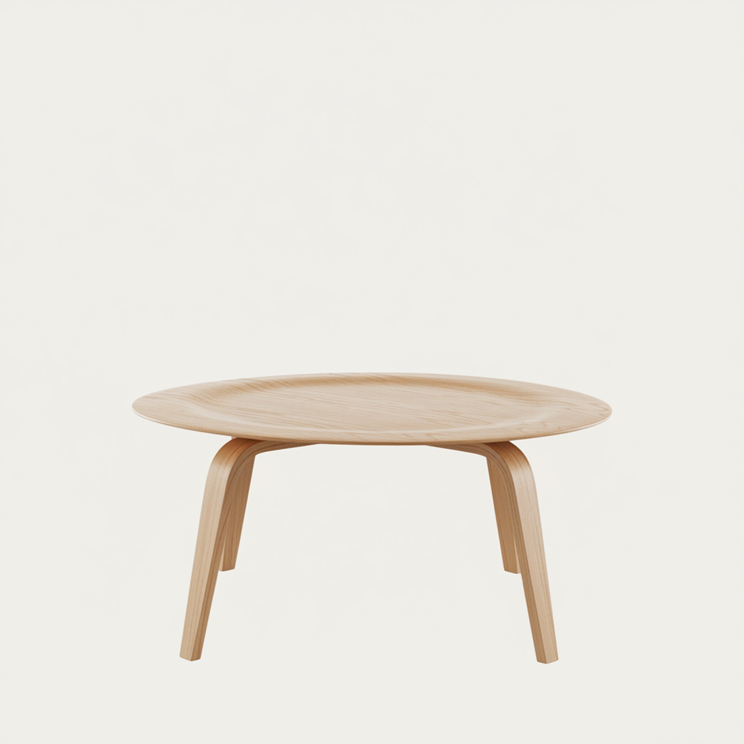 Design-Couchtisch CTW von Charles & Ray Eames (1946) mit runder Massivholzplatte und elegant gebogenen Holzbeinen, zeitloses Bauhaus-inspiriertes Design