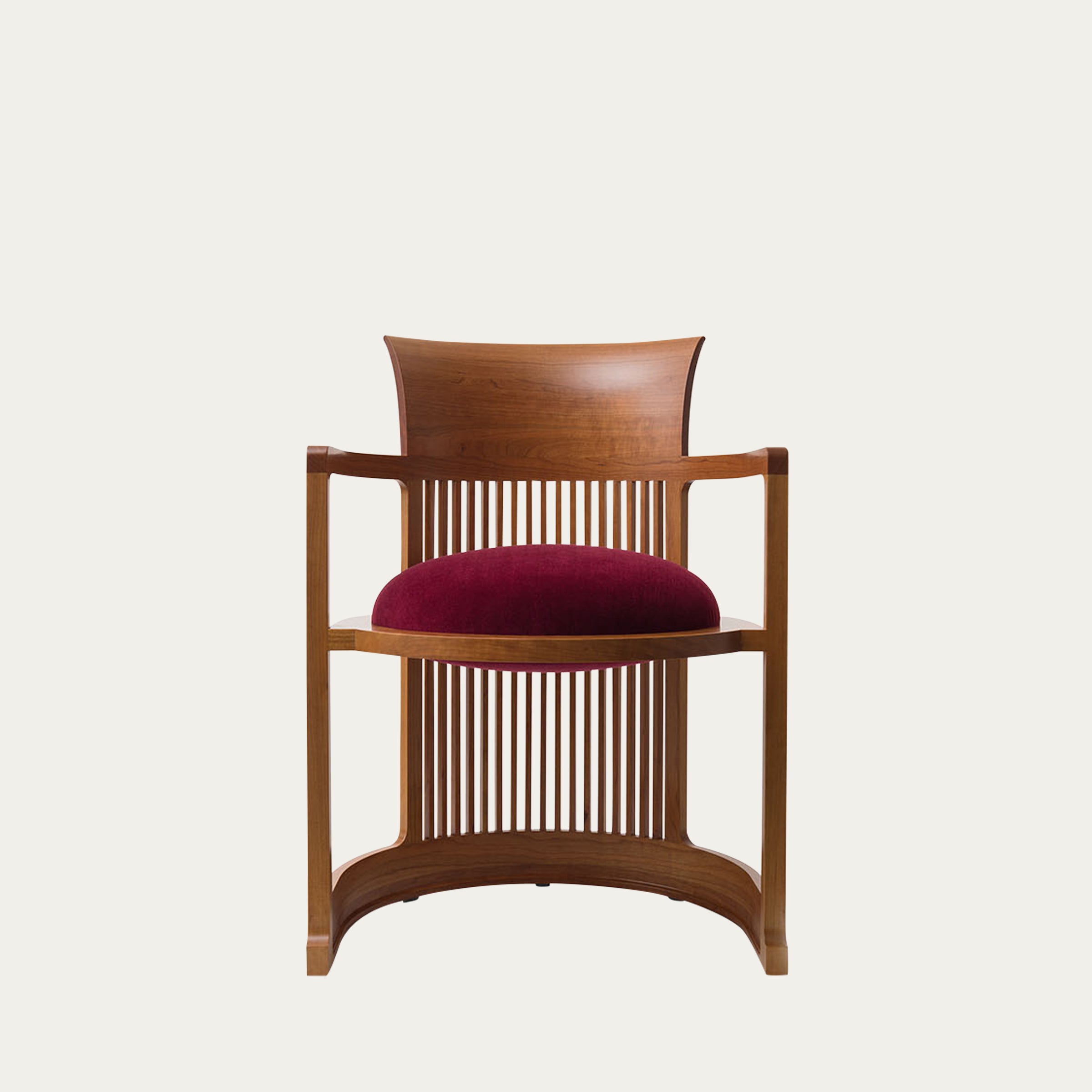 Frontansicht des Barrel Chairs von Frank Lloyd Wright in Kirschholzoptik mit rundem bordeauxfarbenem Sitzkissen